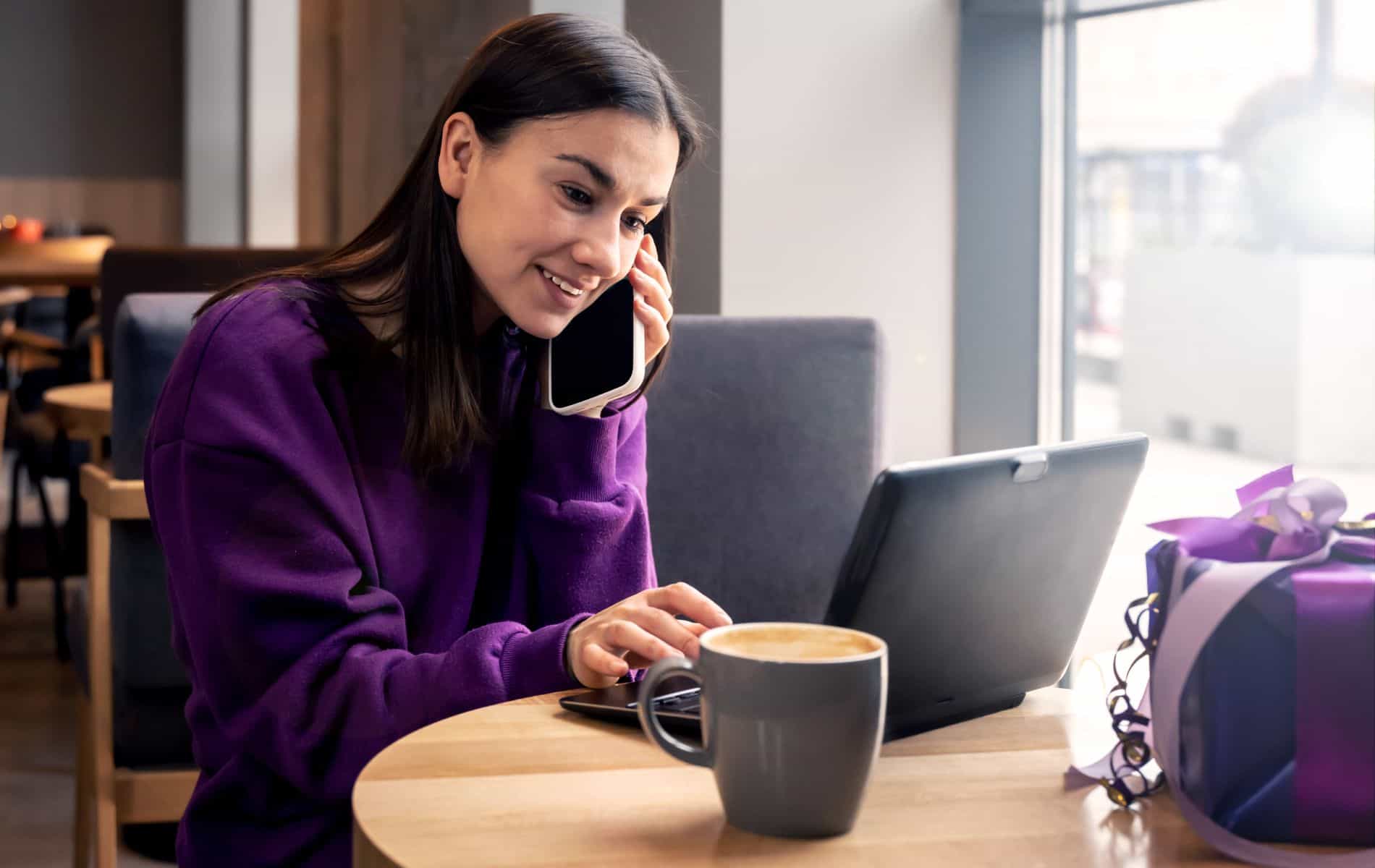 lady on her phone and laptop